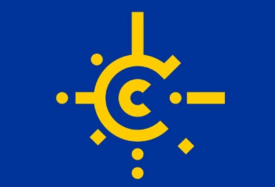 Dunkelblaue Flagge mit einem goldenen, nach rechts offenen Ring, umgeben von goldenen Strahlen, Punkten und Rauten.